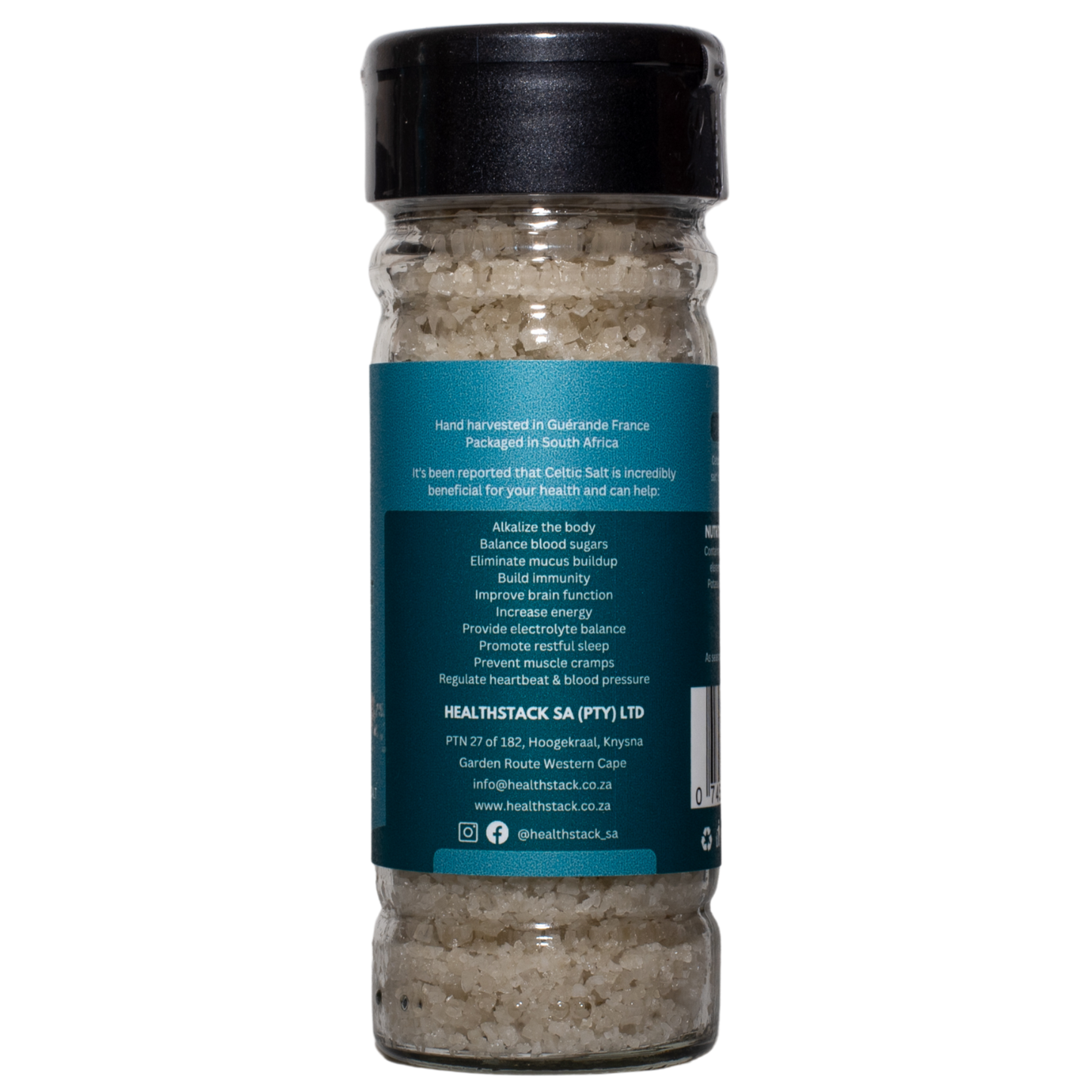 Side of a 100g HealthStack celtic salt glass bottle with recyclable plastic flip top lid, showing potential health benefits and company details.